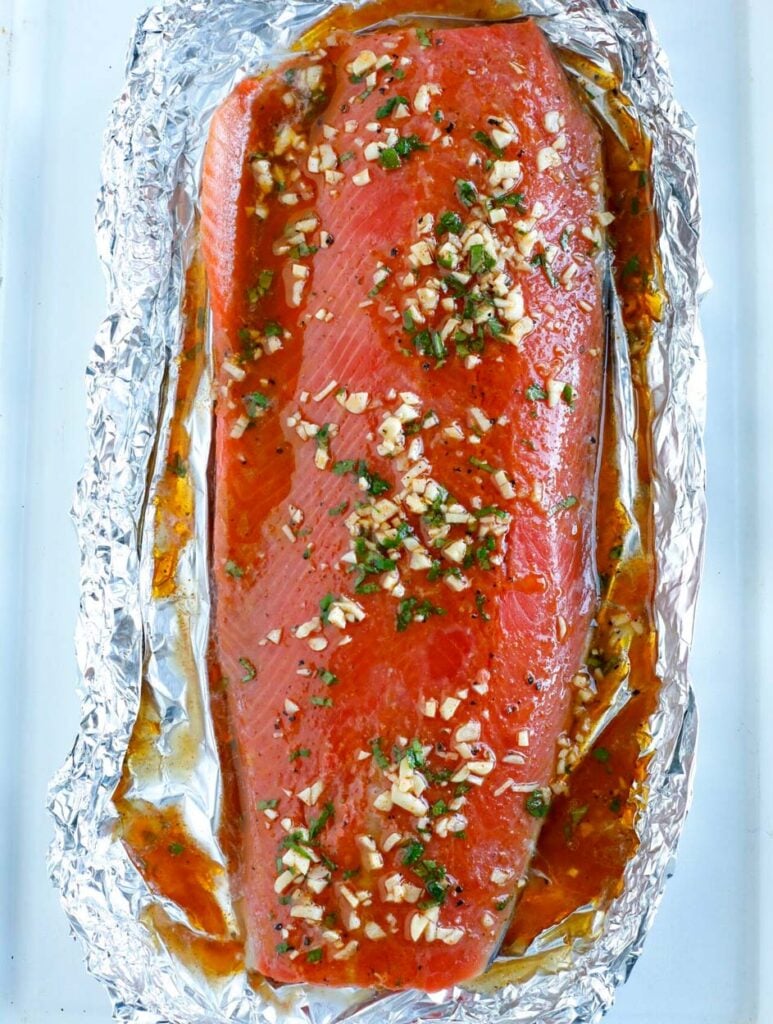 overhead shot of Marinated salmon fillet in foil