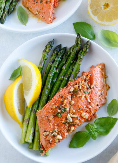 Baked Honey Garlic Salmon serve with a side of veggies, pasta, potatoes