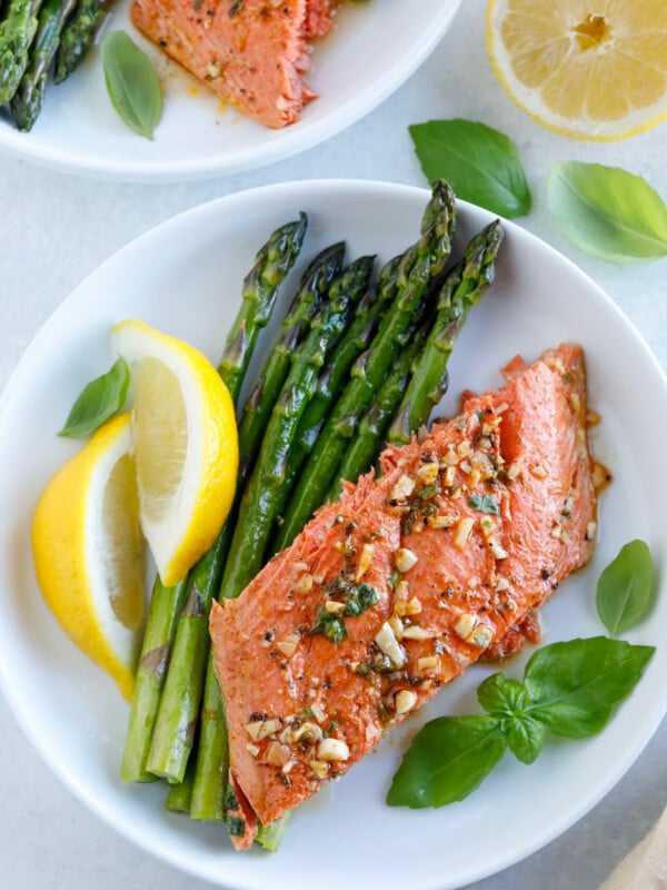 Baked Honey Garlic Salmon serve with a side of veggies, pasta, potatoes
