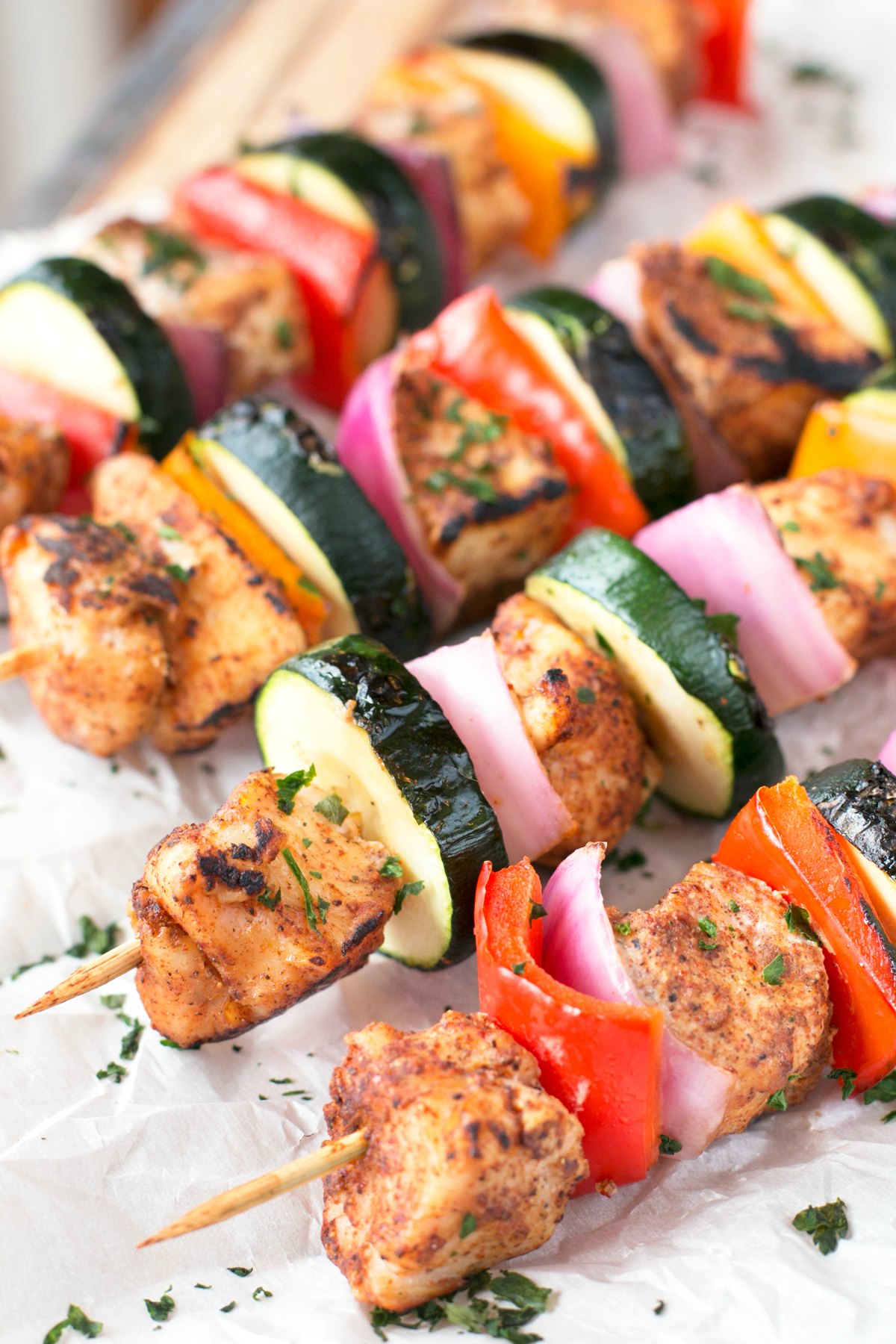 Chicken skewers with zucchini pepper and onion on a baking sheet