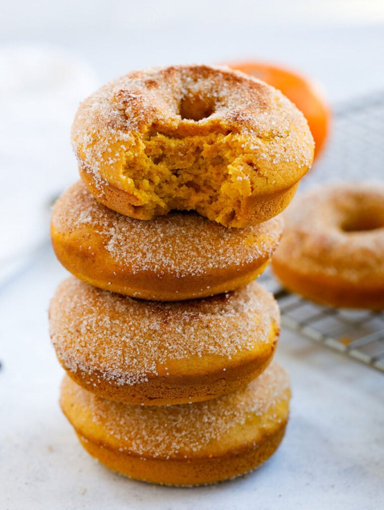 Baked Pumpkin Donut stack of baked pumpkin donuts