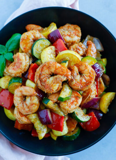 Shrimp and Vegetable served on a black plate
