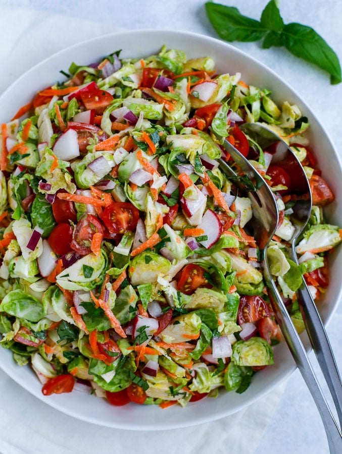 brussels sprouts salad in a white bowl