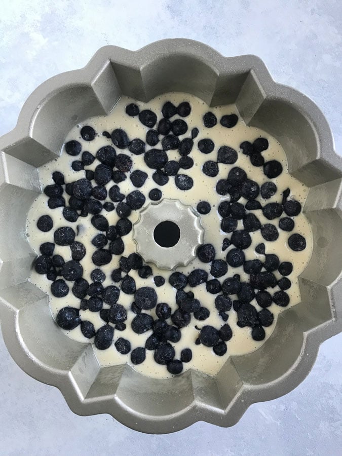 Blueberry cake mixture in a bundt pan.