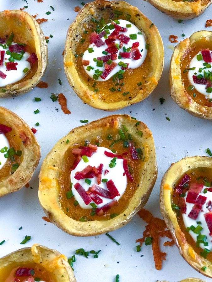 baked potato skins Top down shot of Crispy Baked Potato Skins