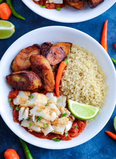 Caribbean Jerk Fish, quinoa, tomato sauce, and fried plantains topped with chilies