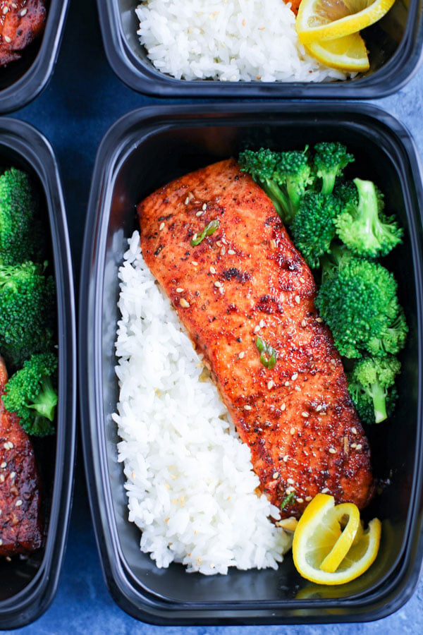 A meal prep box with spicy honey garlic salmon, rice, and broccoli.