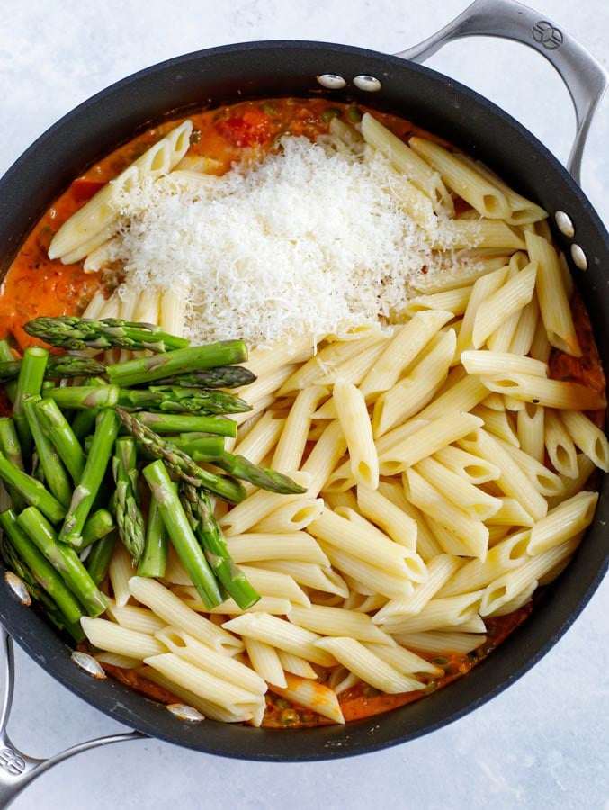 Ingredients for Spicy Chicken Chipotle Pasta in a skillet unstirred.