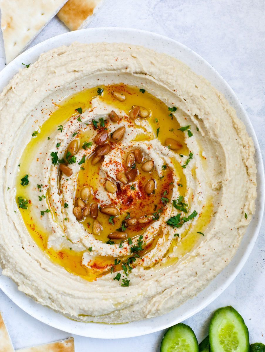 Lebanese hummus in a bowl drizzled with oil