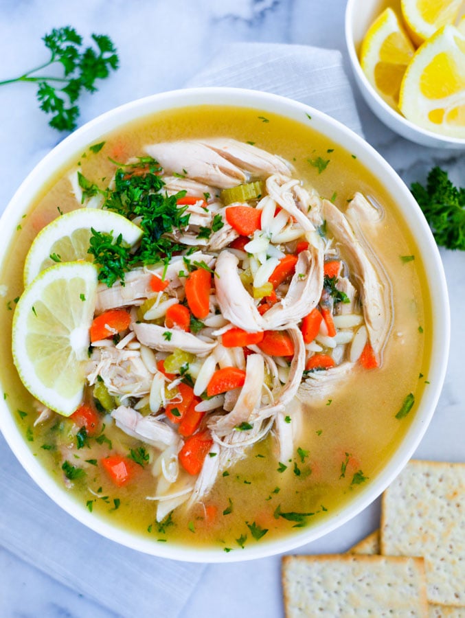 Top down shot of lemon chicken orzo soup.