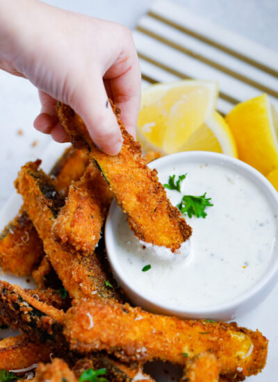 Spicy zucchini fries with parmesan cheese and chopped parsley