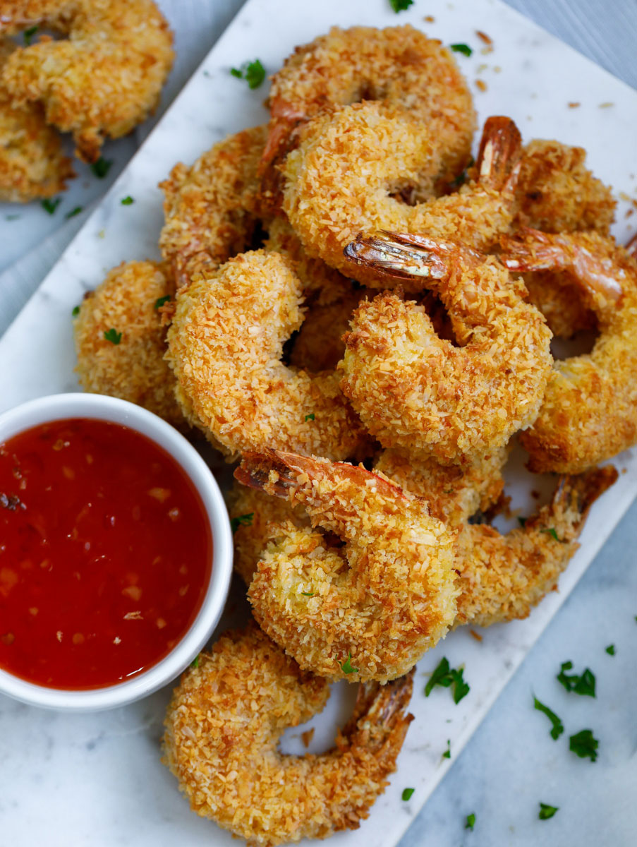 baked coconut shrimp served with a red sauce