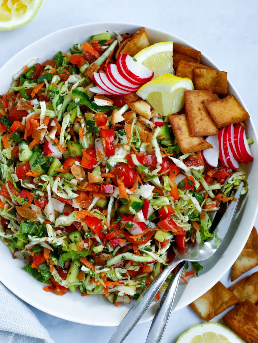 cabbage fattoush salad served in a white bowl