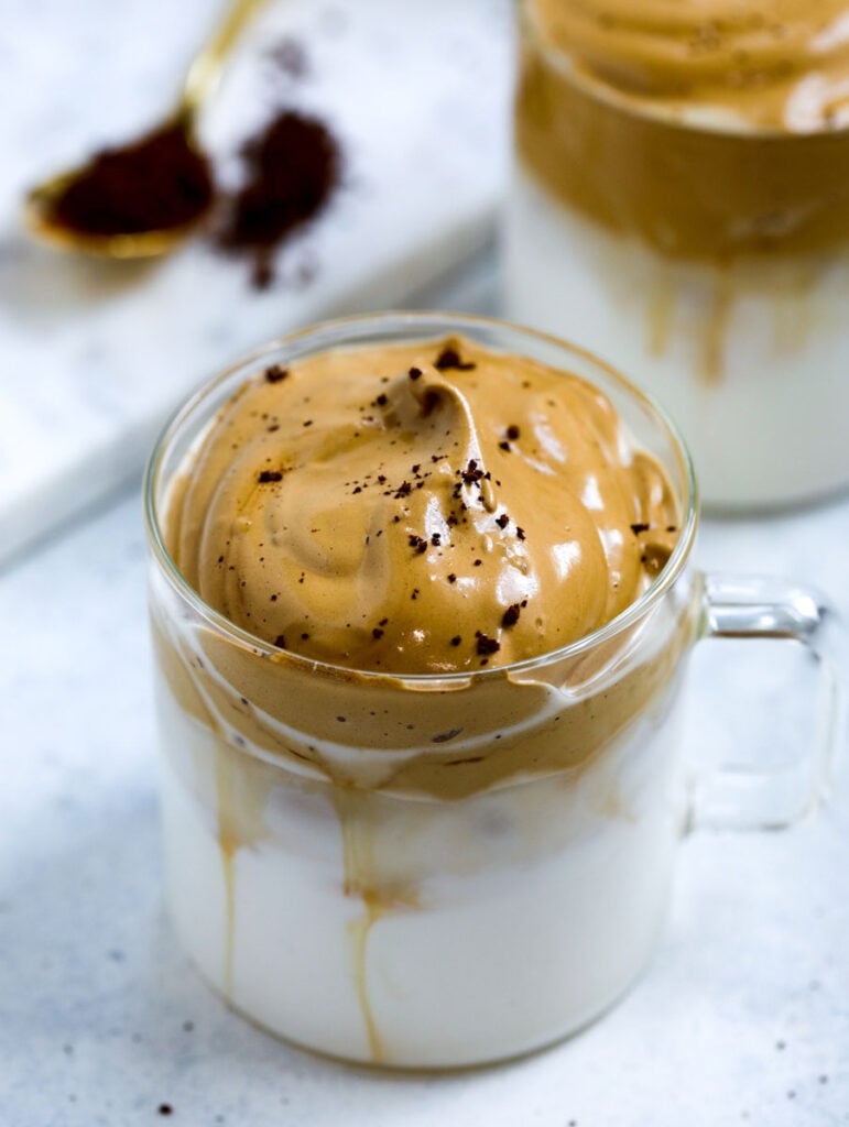 ice milked in a cup topped with whipped coffee