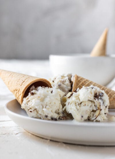 almond joy ice cream balls on a plate with a cone
