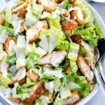 chicken caesar salad served in a dish