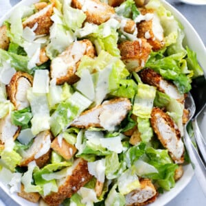 chicken caesar salad served in a dish