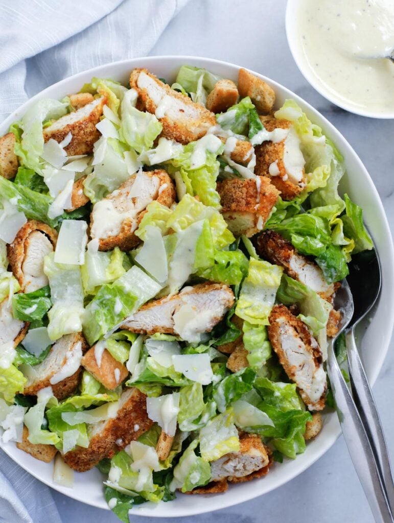 chicken caesar salad served in a dish