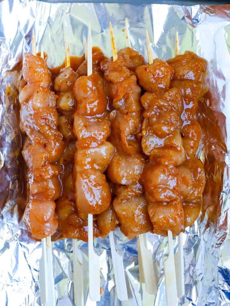 chicken marinating on skewers