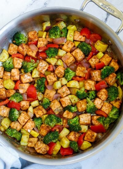 salmon with vegetables served in a skillet