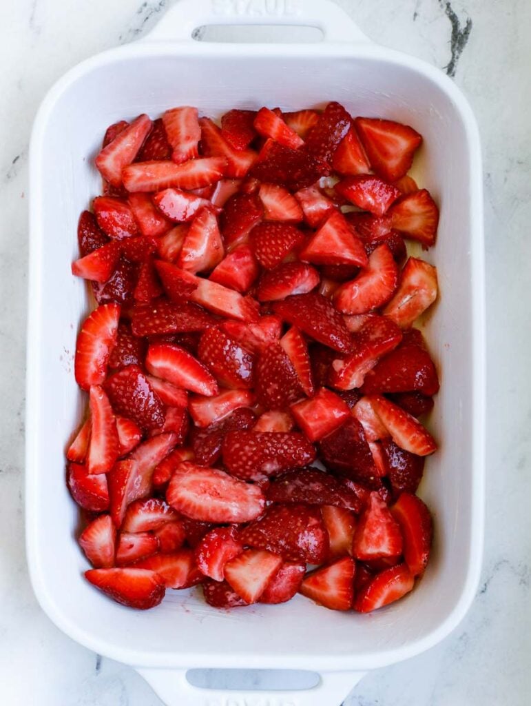 strawberry crisp filling in a baking dish