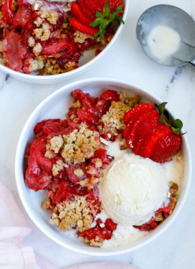 Strawberry Crisp served in a bowl with a scoop of ice cream
