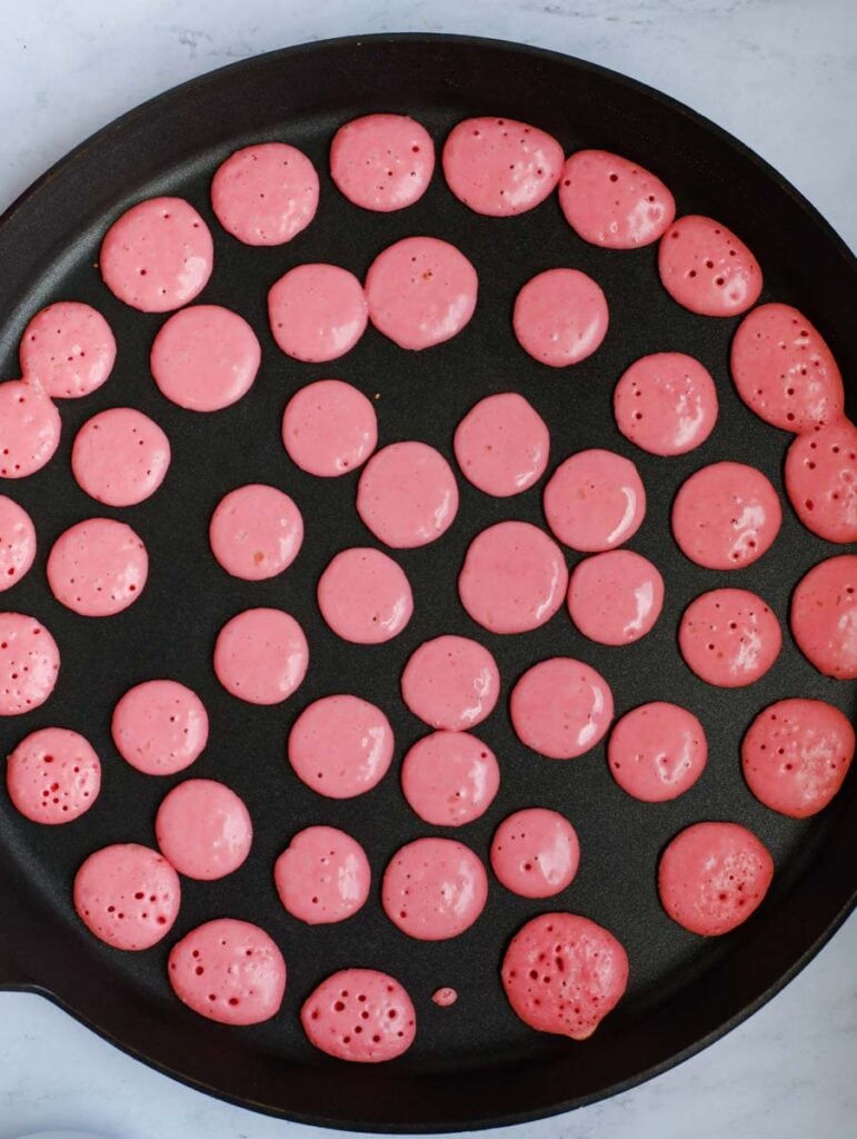 mini strawberry pancakes being cooked