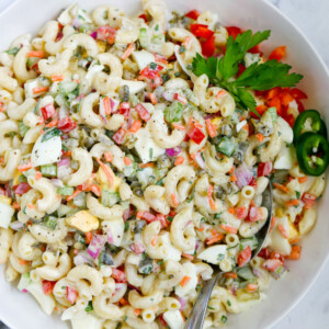macaroni salad served in a bowl with a spoon
