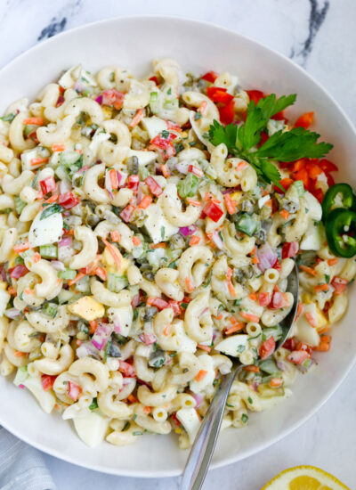 macaroni salad served in a bowl with a spoon