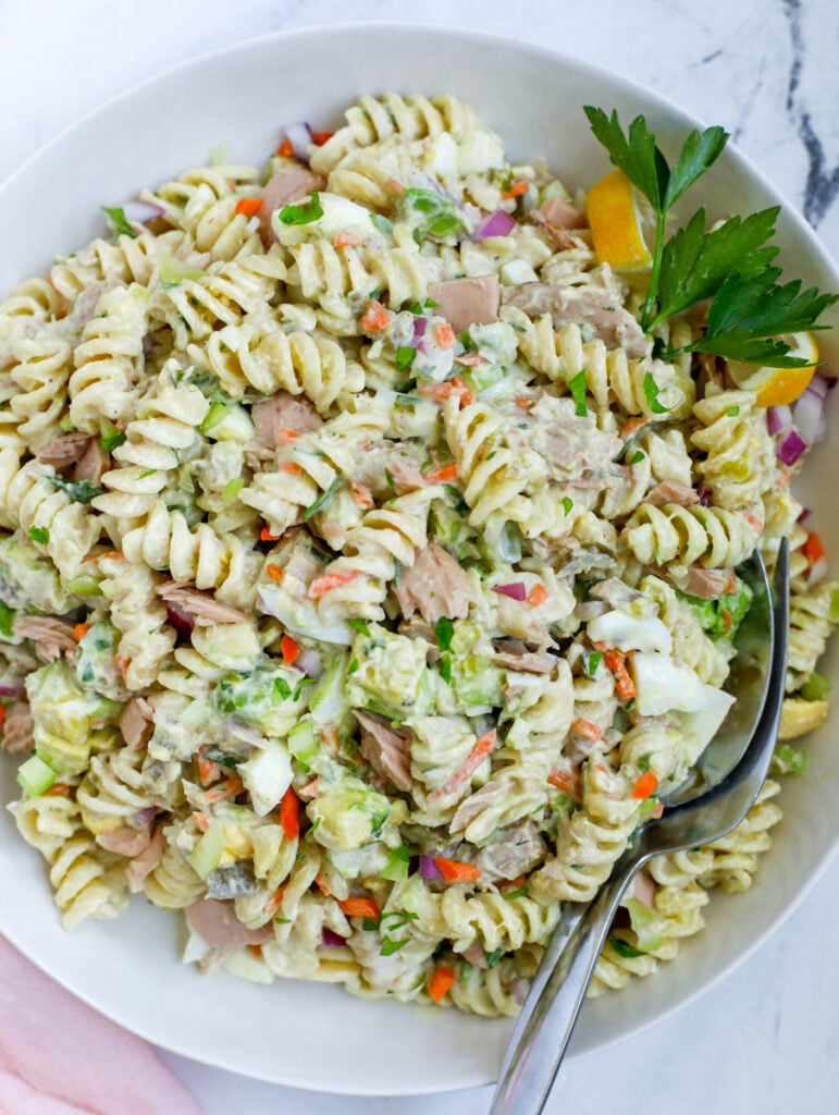 Tuna Pasta Salad Recipe in a bowl with a fork and spoon 