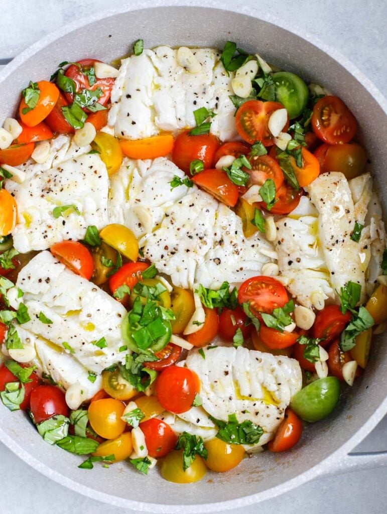cod with grape tomatoes in a bowl 