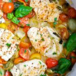 top donw shot of Oven Baked Cod in a white skillet