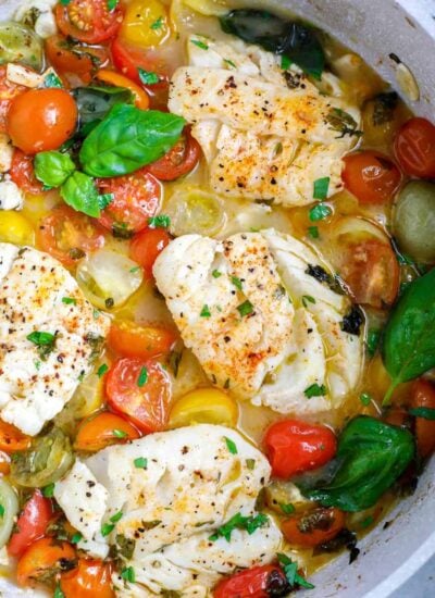 top donw shot of Oven Baked Cod in a white skillet