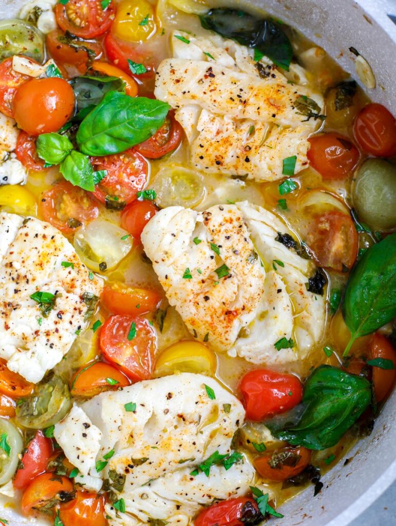 top donw shot of Oven Baked Cod in a white skillet