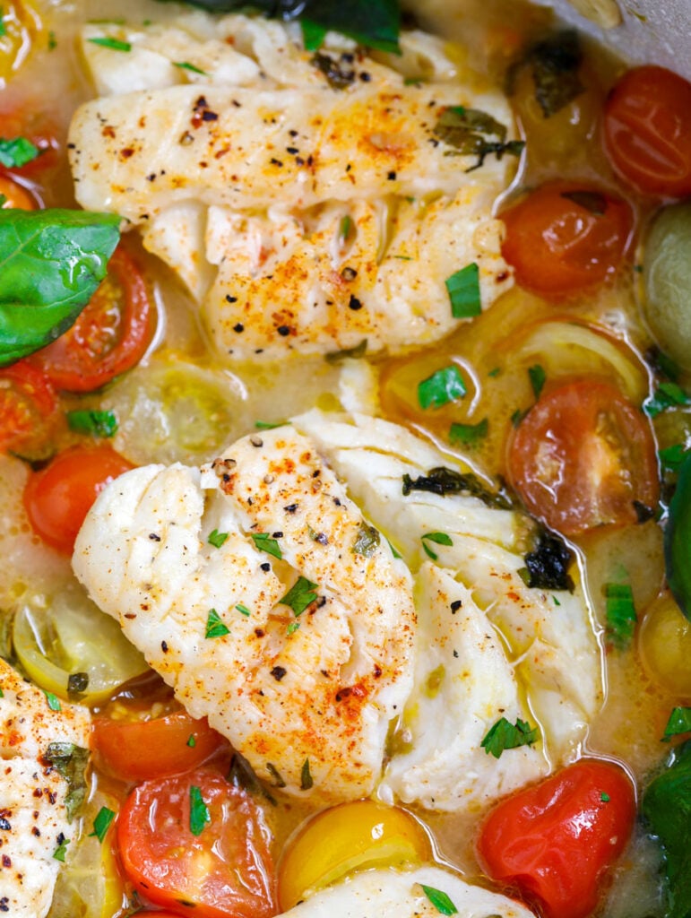 close up of cod with herbs