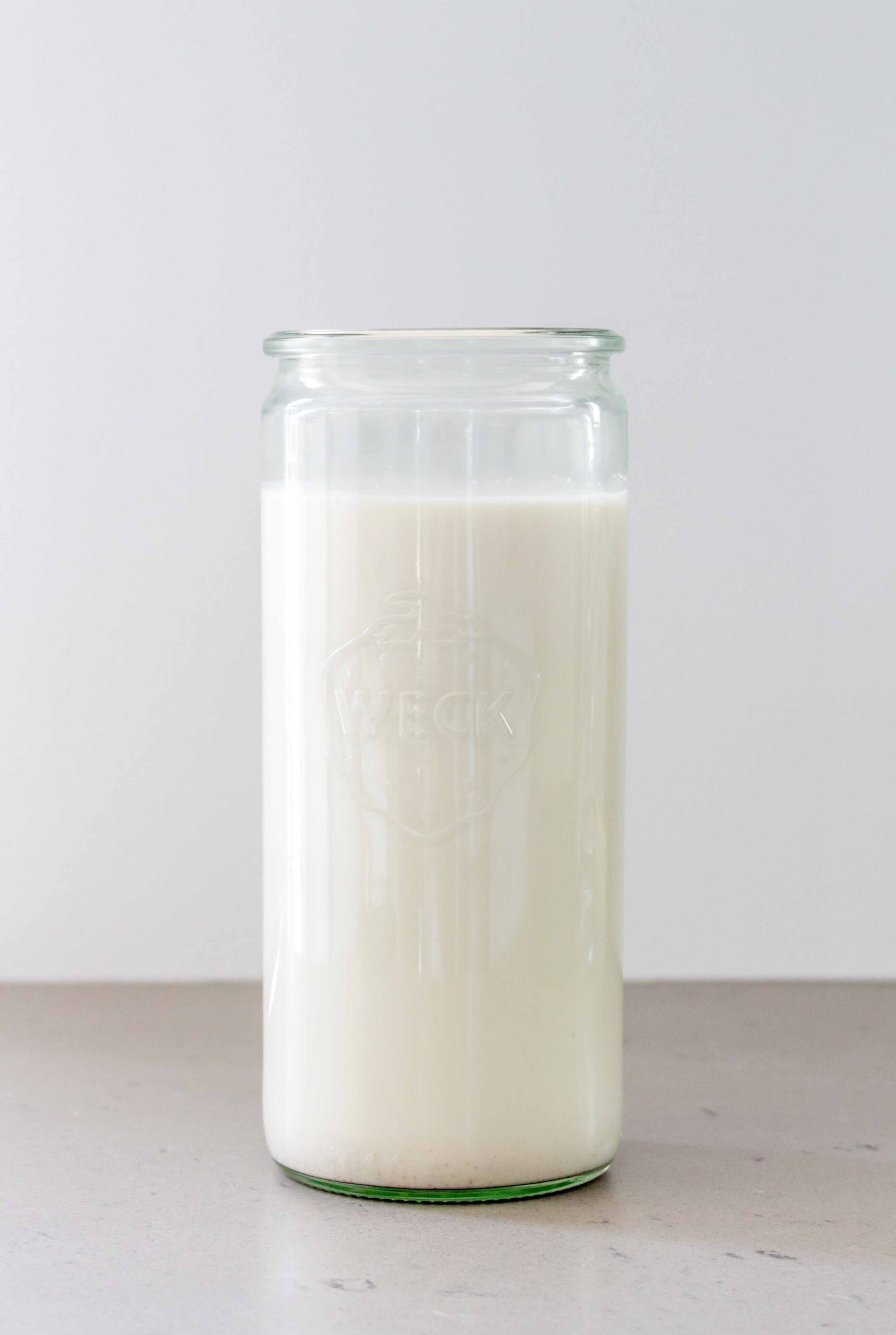 glass bottle of almond milk