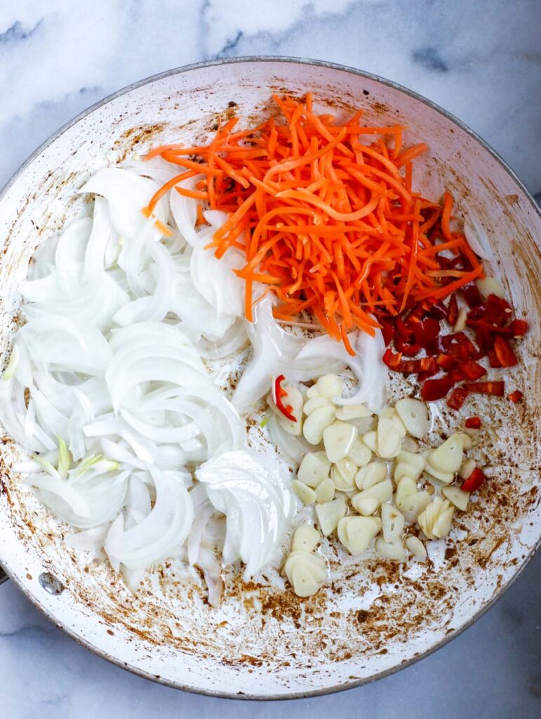 carrots, onions, garlic and chili in a bowl.