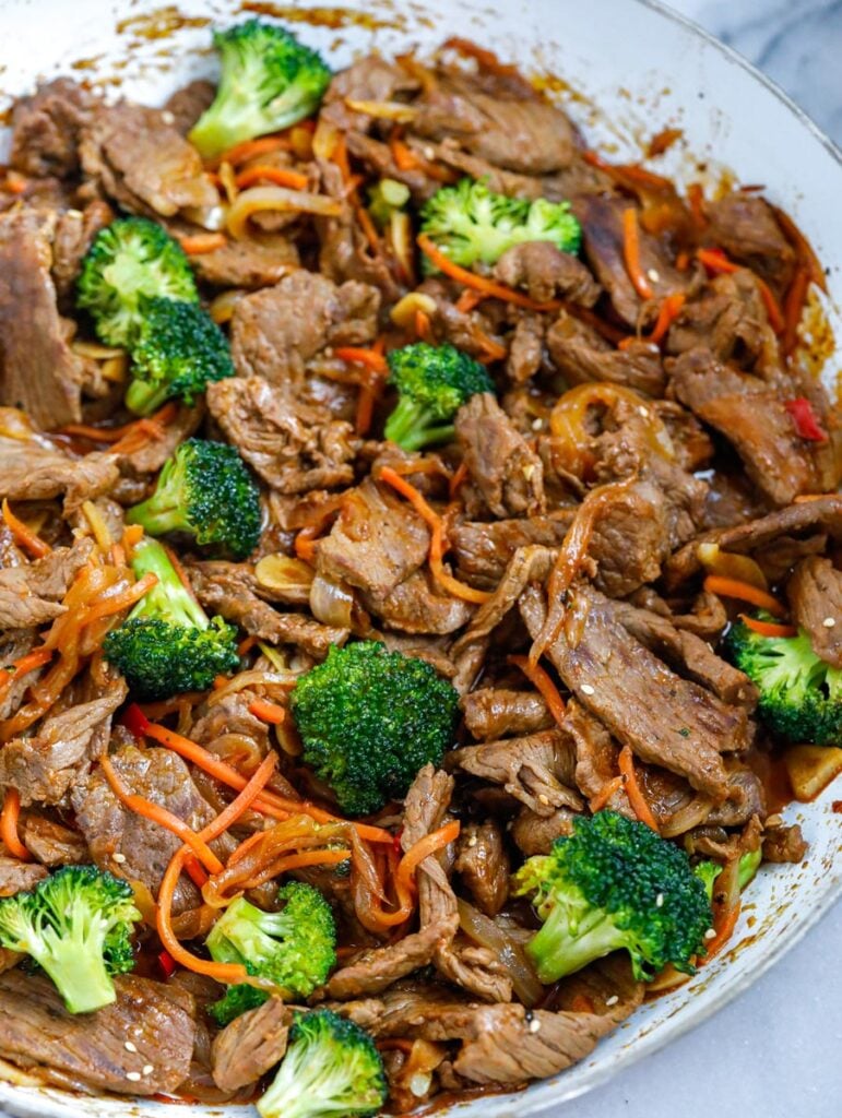 overhead shot of Beef and Broccoli Stir Fry in a white bowl