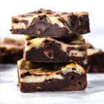 cheesecake swirled cookies stacked on top of each other