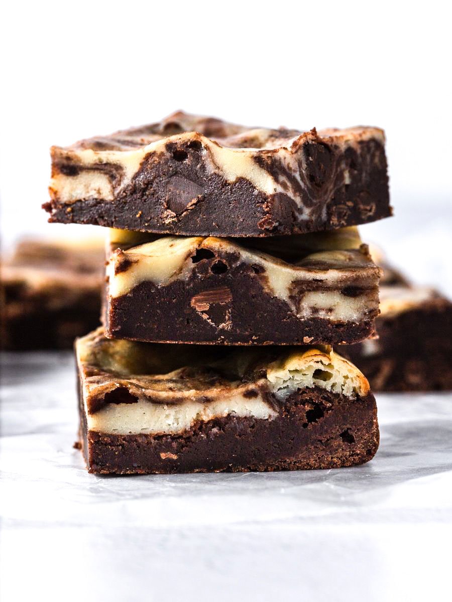 cheesecake swirled cookies stacked on top of each other