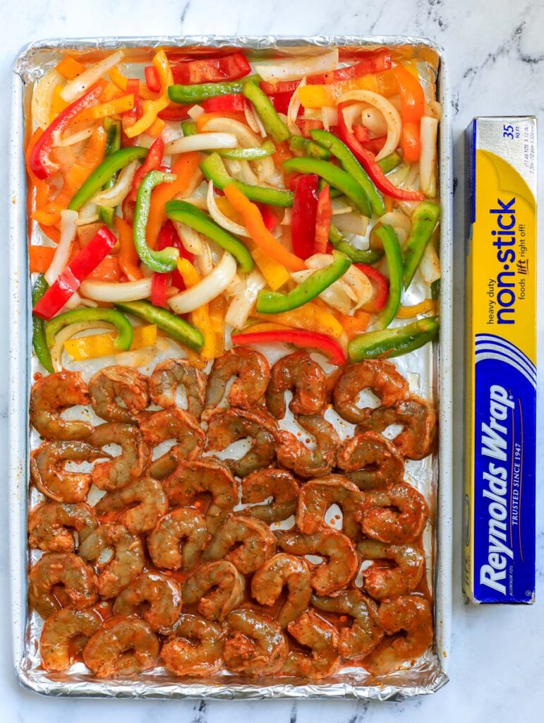 shrimp fajita raw on a sheet pan uncooked