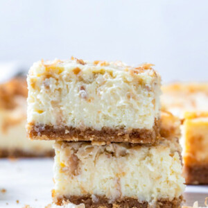 two cheesecake bars stacked up on each other