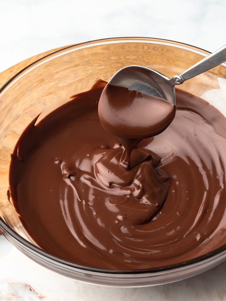 melted chocolate in a bowl with a spoon