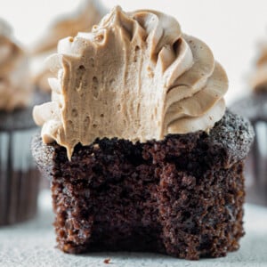 close up shot of chocolate cupcake with a bite taken out of it