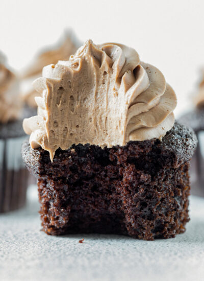 close up shot of chocolate cupcake with a bite taken out of it