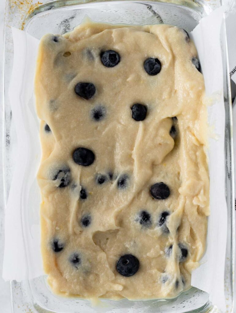 top down shot of blueberry lemon bread batter in a baking dish