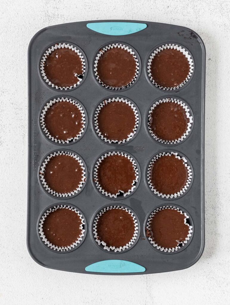 chocolate cupcake batter in muffin pan