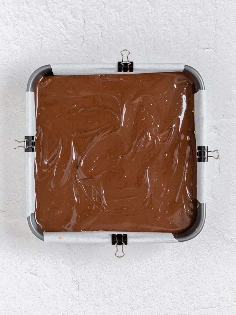 the mixture of the bars in a square pan after it's assembled