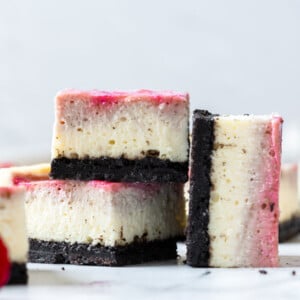 two cheesecake bars stacked up with one on the side