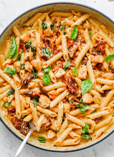 Creamy sun-dried tomato pasta in a pot.